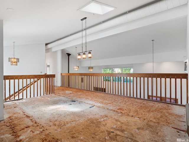 spare room featuring an inviting chandelier