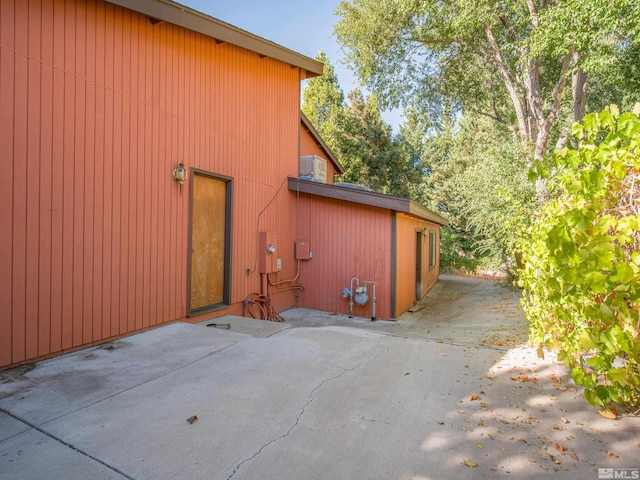 view of side of property featuring a patio area