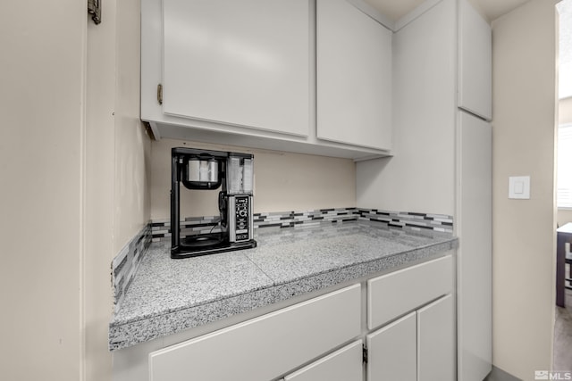 kitchen featuring white cabinetry