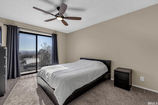 carpeted bedroom featuring ceiling fan, access to outside, and a textured ceiling