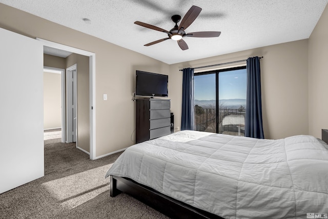 bedroom featuring ceiling fan, carpet, and a textured ceiling