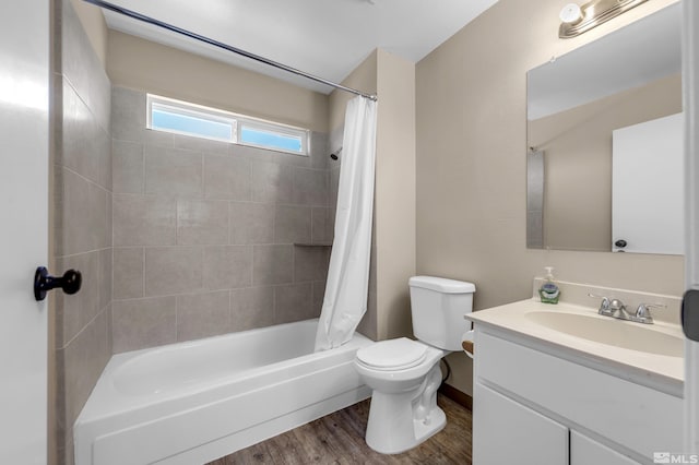 full bathroom with vanity, hardwood / wood-style floors, shower / tub combo, and toilet