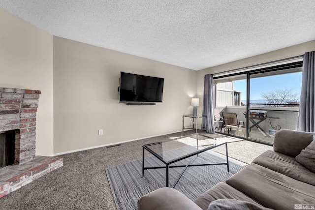 carpeted living room with a textured ceiling and a fireplace