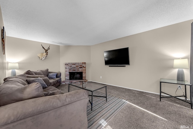 living room with a brick fireplace, carpet floors, and a textured ceiling