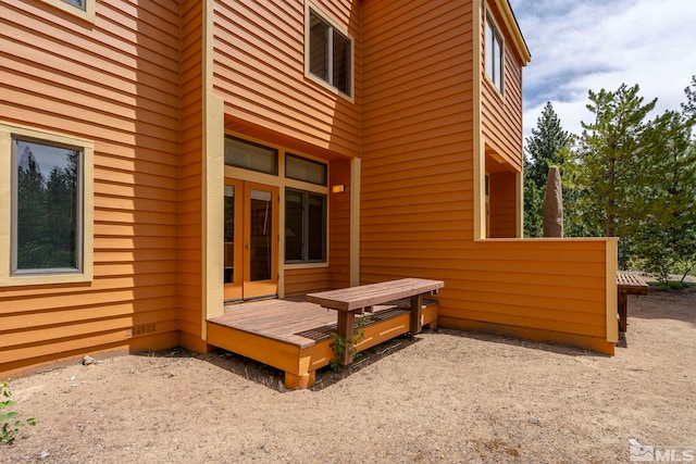 view of home's exterior featuring a wooden deck