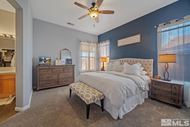 carpeted bedroom with ceiling fan