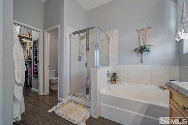 full bathroom featuring toilet, vanity, and plus walk in shower