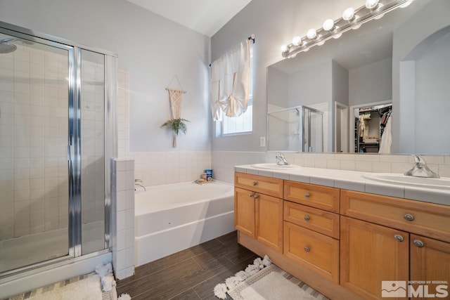 bathroom with vanity and plus walk in shower