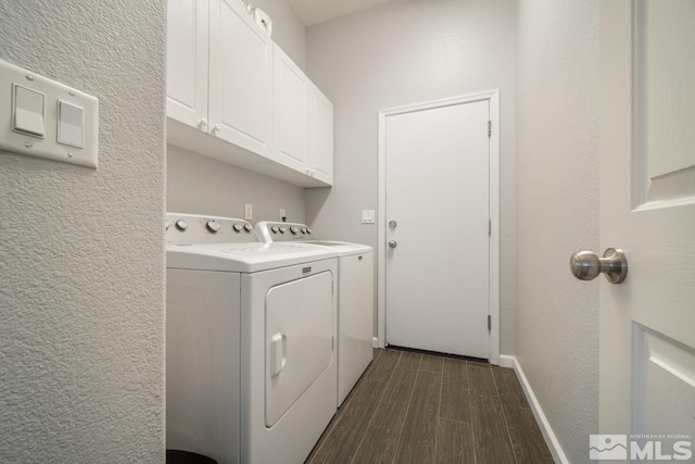 laundry room with cabinets and washer and clothes dryer