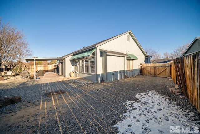 rear view of house featuring a patio area