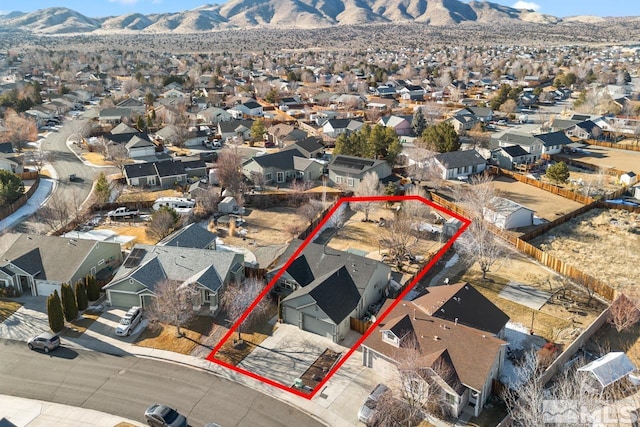 birds eye view of property featuring a mountain view