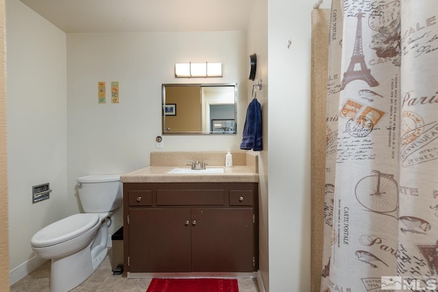 bathroom with vanity, a shower with curtain, and toilet