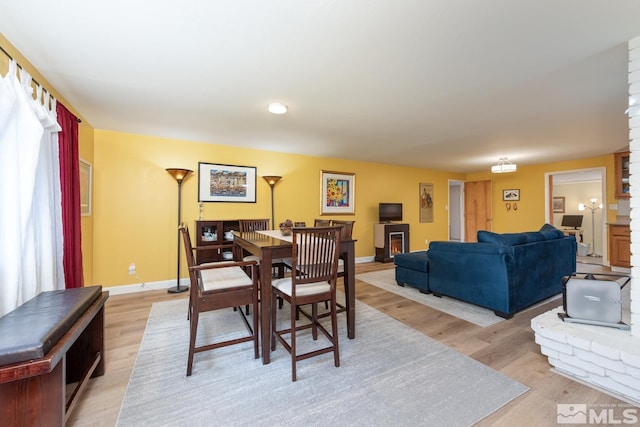 dining room with light wood-type flooring