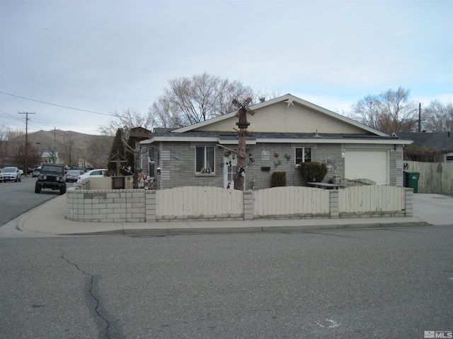 ranch-style home featuring a garage