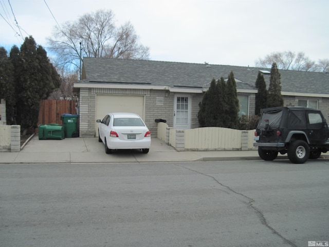 single story home featuring a garage