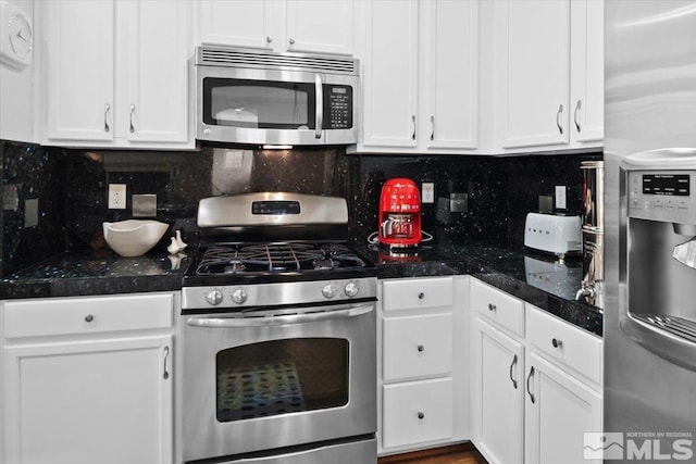 kitchen featuring white cabinetry, appliances with stainless steel finishes, and backsplash