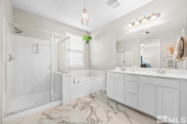 bathroom with vanity and separate shower and tub