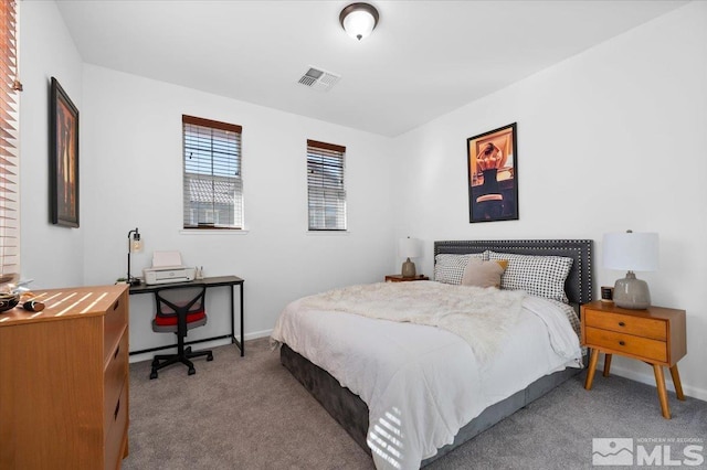 bedroom with light colored carpet