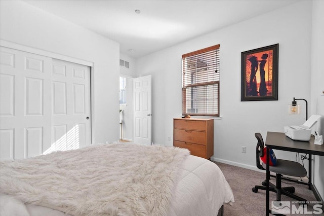 carpeted bedroom featuring a closet