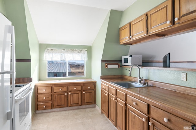 kitchen with sink and white appliances