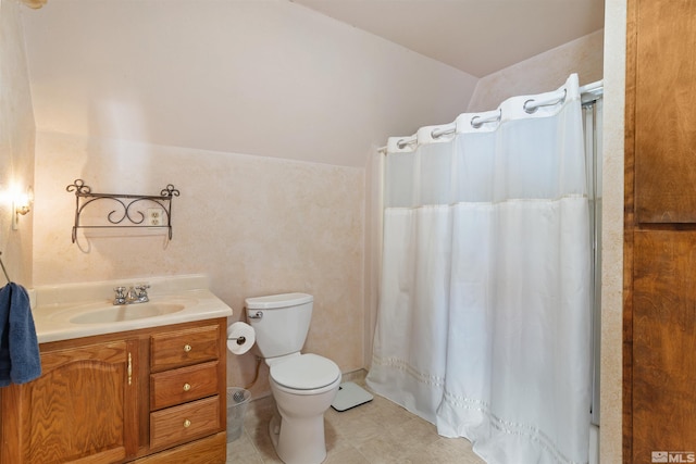 bathroom featuring vanity, toilet, and curtained shower