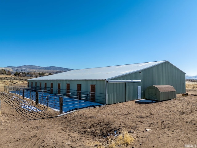 view of outbuilding featuring a mountain view