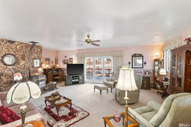 living room featuring light carpet and ceiling fan