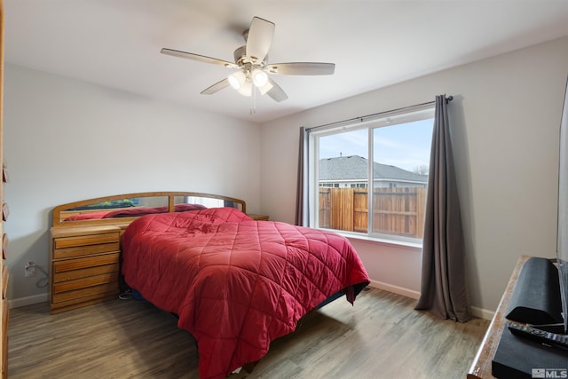 bedroom featuring hardwood / wood-style floors and ceiling fan