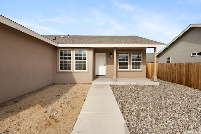 property entrance featuring a patio area