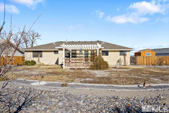 back of house featuring a pergola