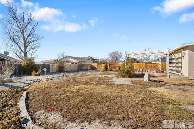 view of yard with a pergola