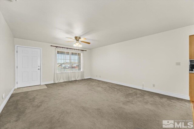 unfurnished room featuring carpet floors and ceiling fan