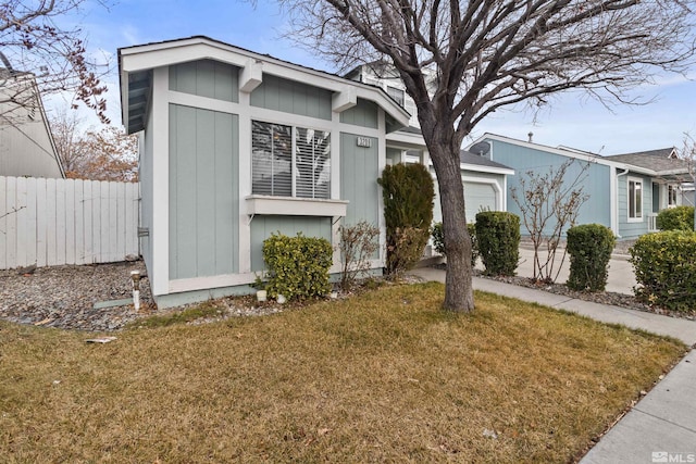 view of front of house featuring a garage and a front yard