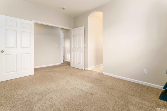 unfurnished bedroom featuring light colored carpet