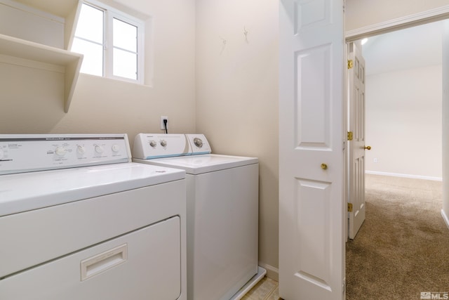 laundry area with light colored carpet and independent washer and dryer