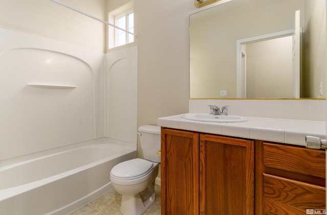 full bathroom with tile patterned flooring, vanity, tub / shower combination, and toilet