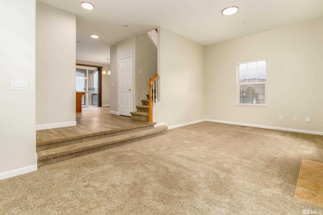 carpeted empty room featuring plenty of natural light