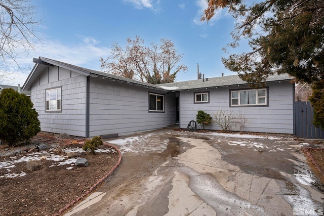 ranch-style home with a patio area, fence, and concrete driveway