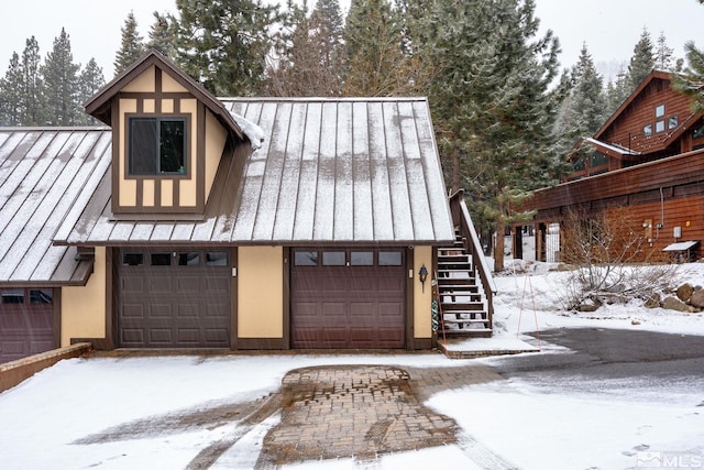 view of snow covered garage