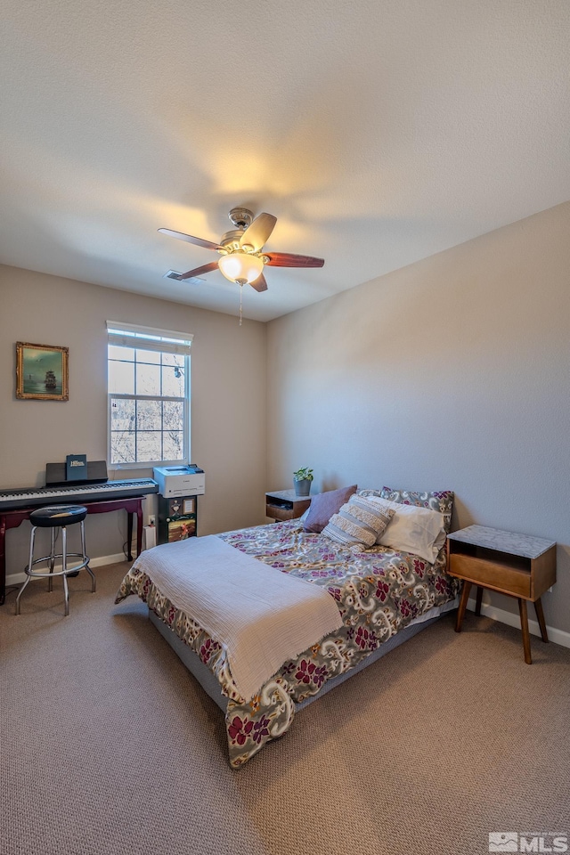 bedroom featuring ceiling fan and carpet floors