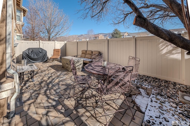 view of patio / terrace with a mountain view