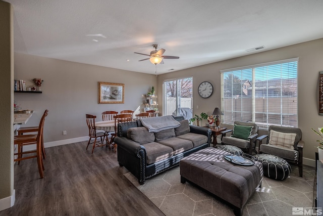 living room featuring hardwood / wood-style flooring, ceiling fan, plenty of natural light, and a textured ceiling