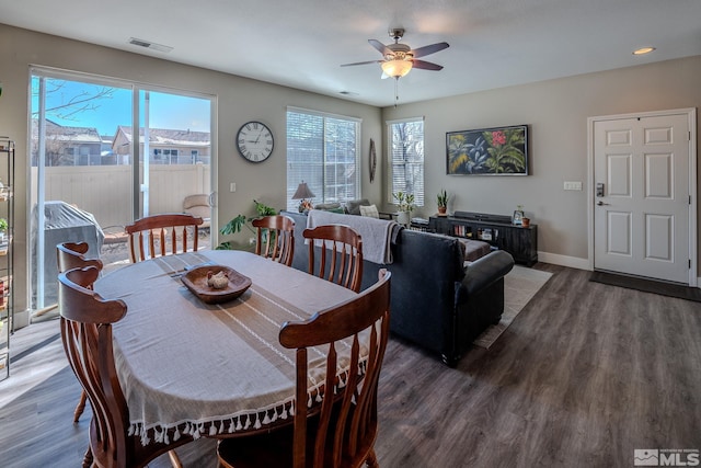 dining area featuring ceiling fan and dark hardwood / wood-style flooring