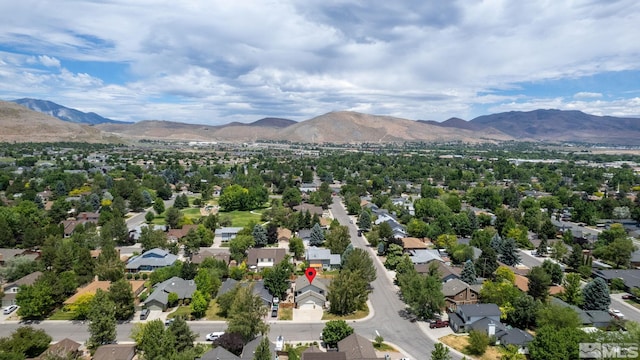 birds eye view of property with a mountain view