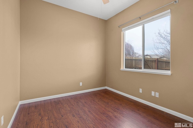 spare room with hardwood / wood-style flooring and ceiling fan