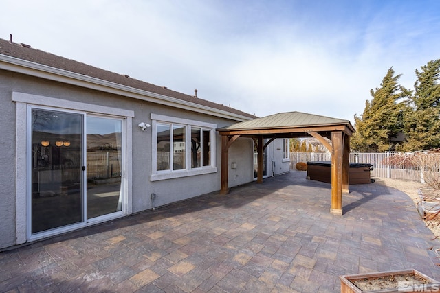 view of patio with a gazebo and a hot tub