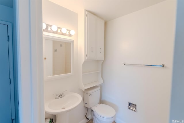 bathroom with toilet and sink