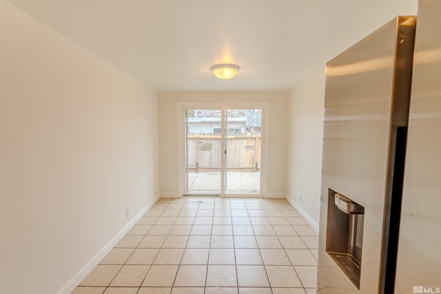 spare room with light tile patterned flooring