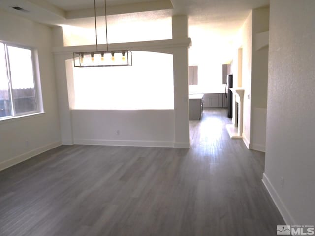 unfurnished dining area with dark hardwood / wood-style flooring