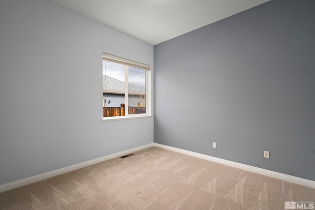 empty room with carpet flooring